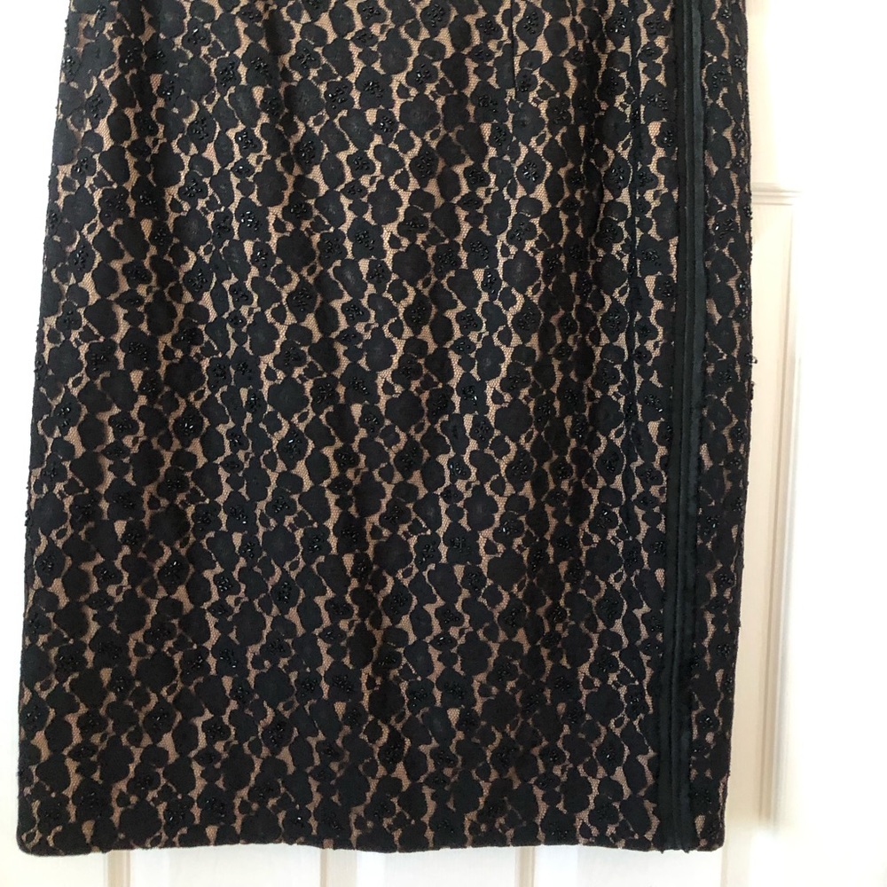 Lace beaded evening skirt, below the knee.